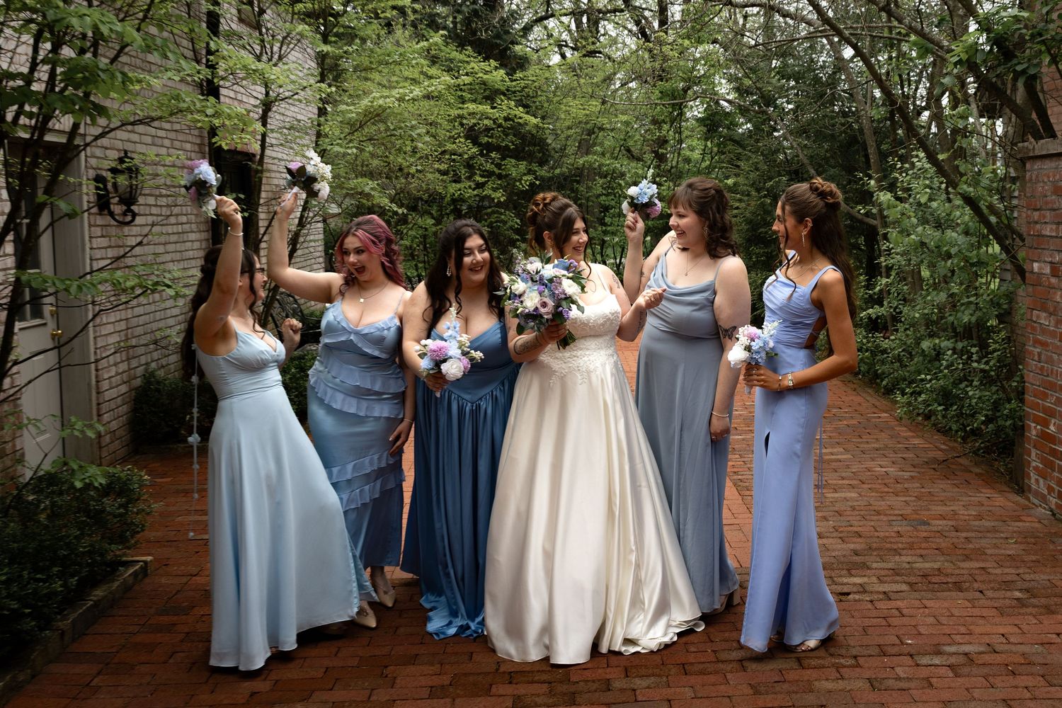 Bride with bridesmaids smelling