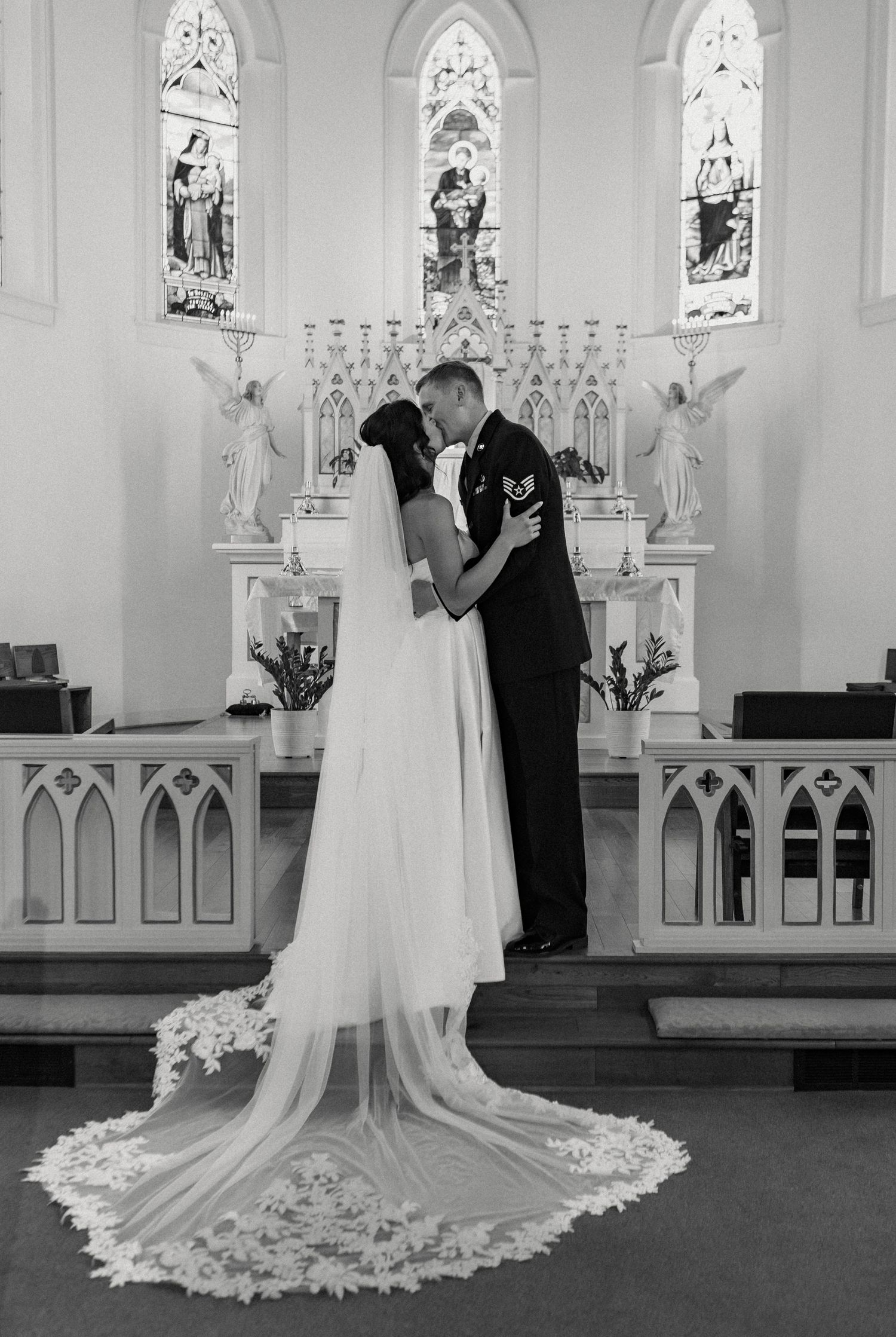 Series of black and white photos capturing intimate wedding moments in a traditional church setting.