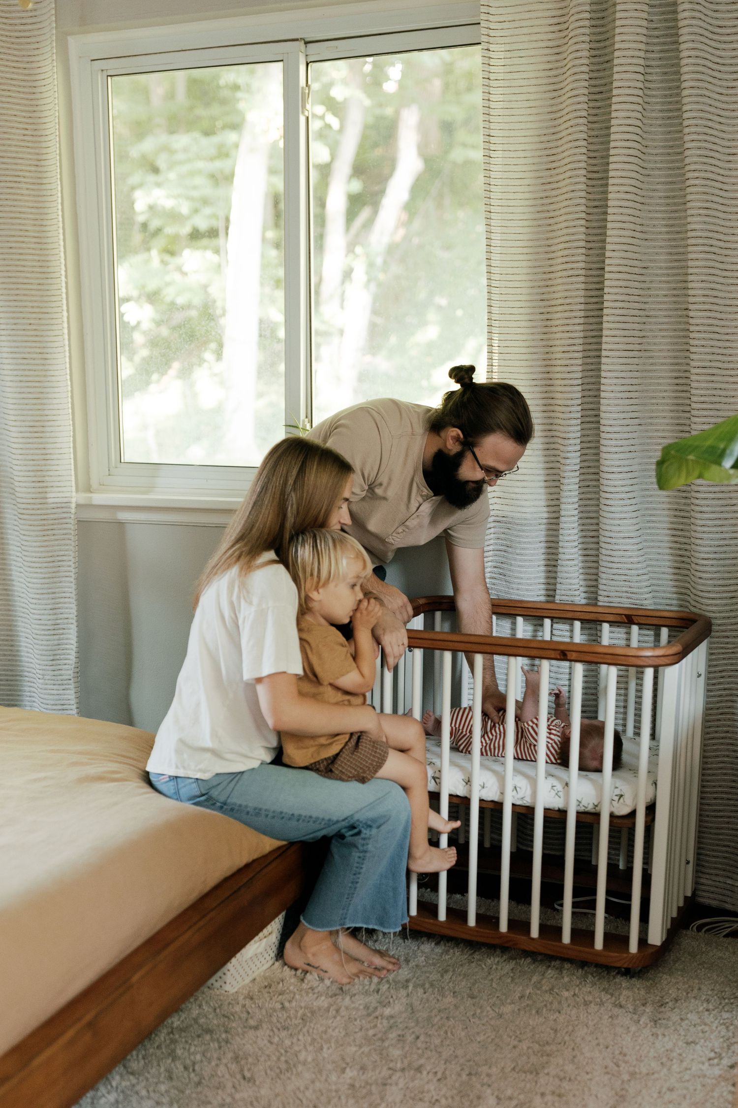 Intimate lifestyle photos taken by window with natural light streaming in.