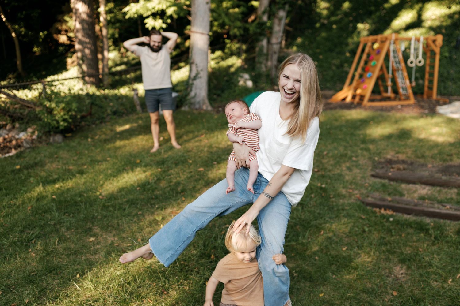 Candid outdoor family portraits showing playful interactions in a backyard garden setting.