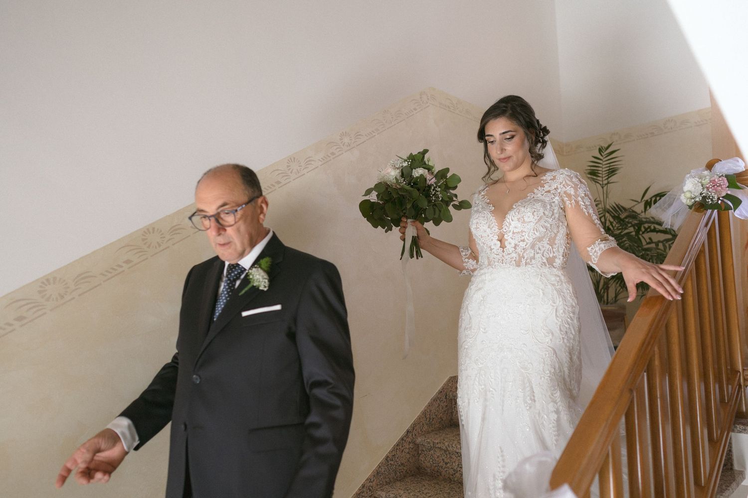 Wedding party members sharing emotional moments in a home setting before the ceremony.