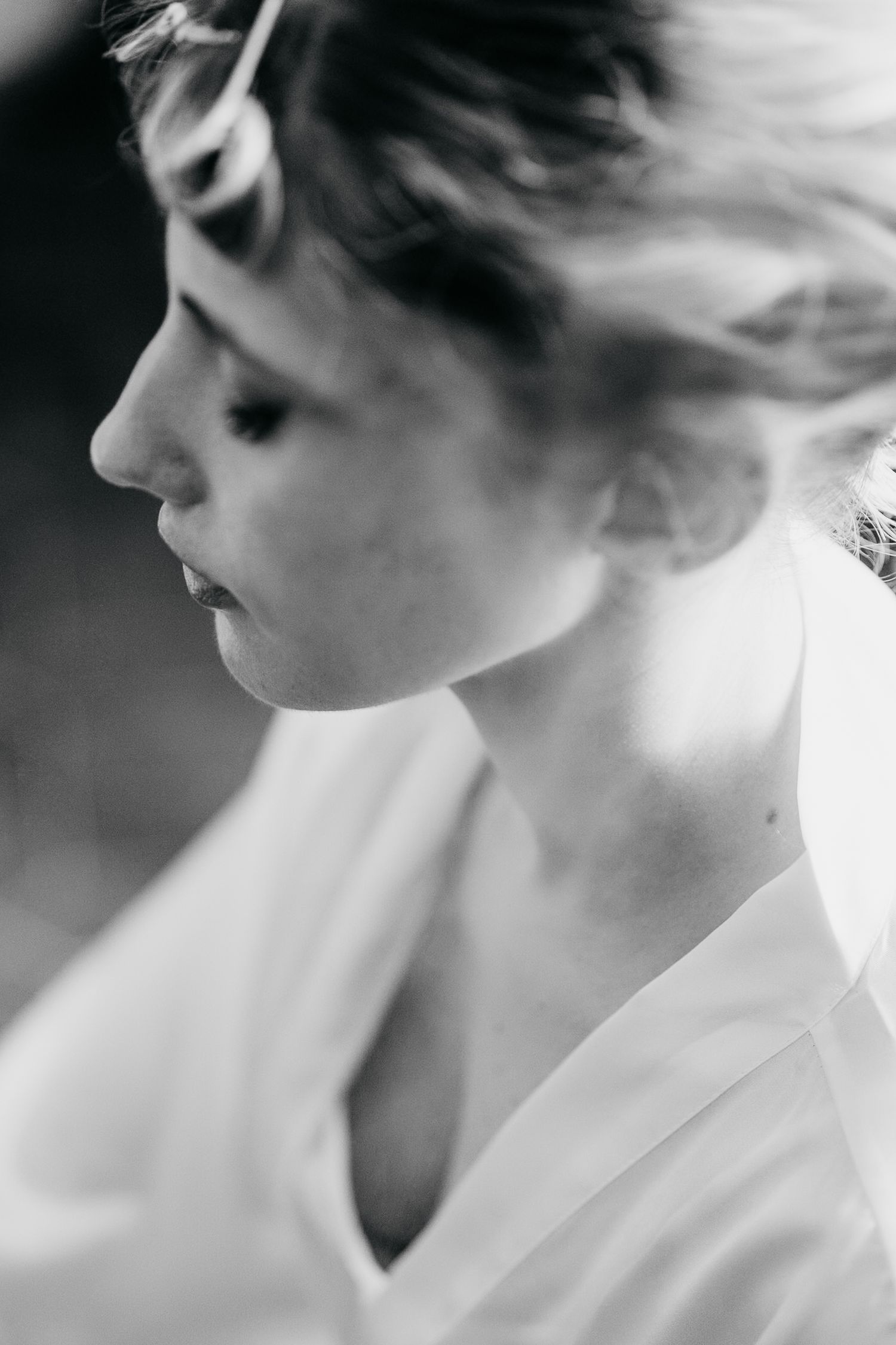 Black and white profile portraits showing elegant upswept hair styling in soft focus.