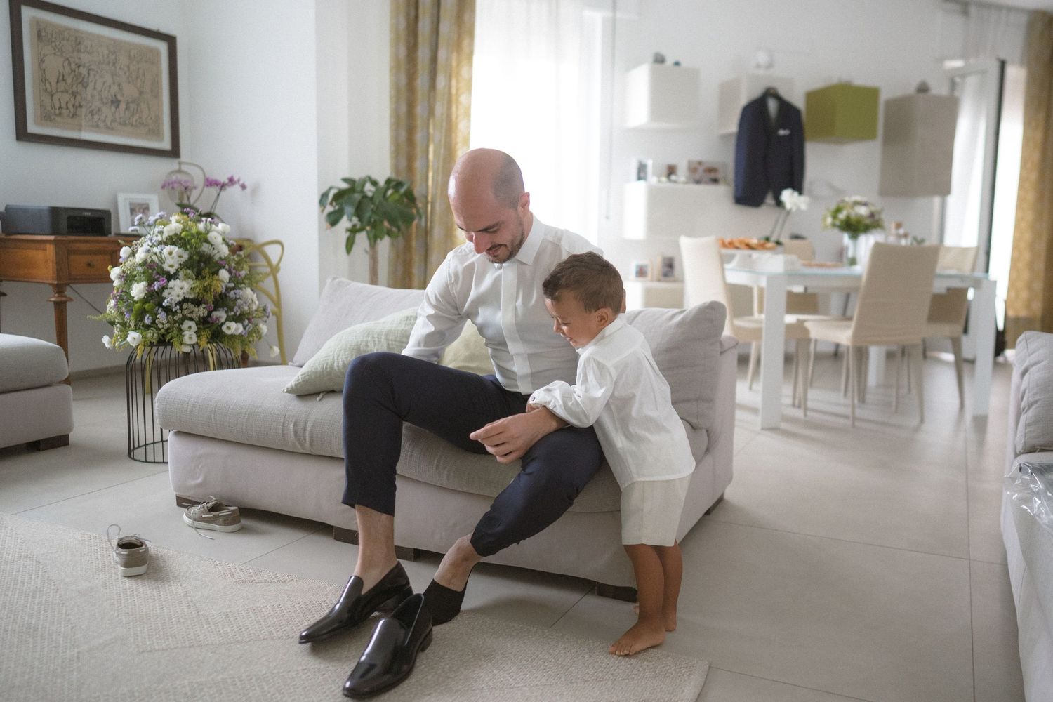Wedding morning preparation sequence showing couple getting ready in bright modern interior.