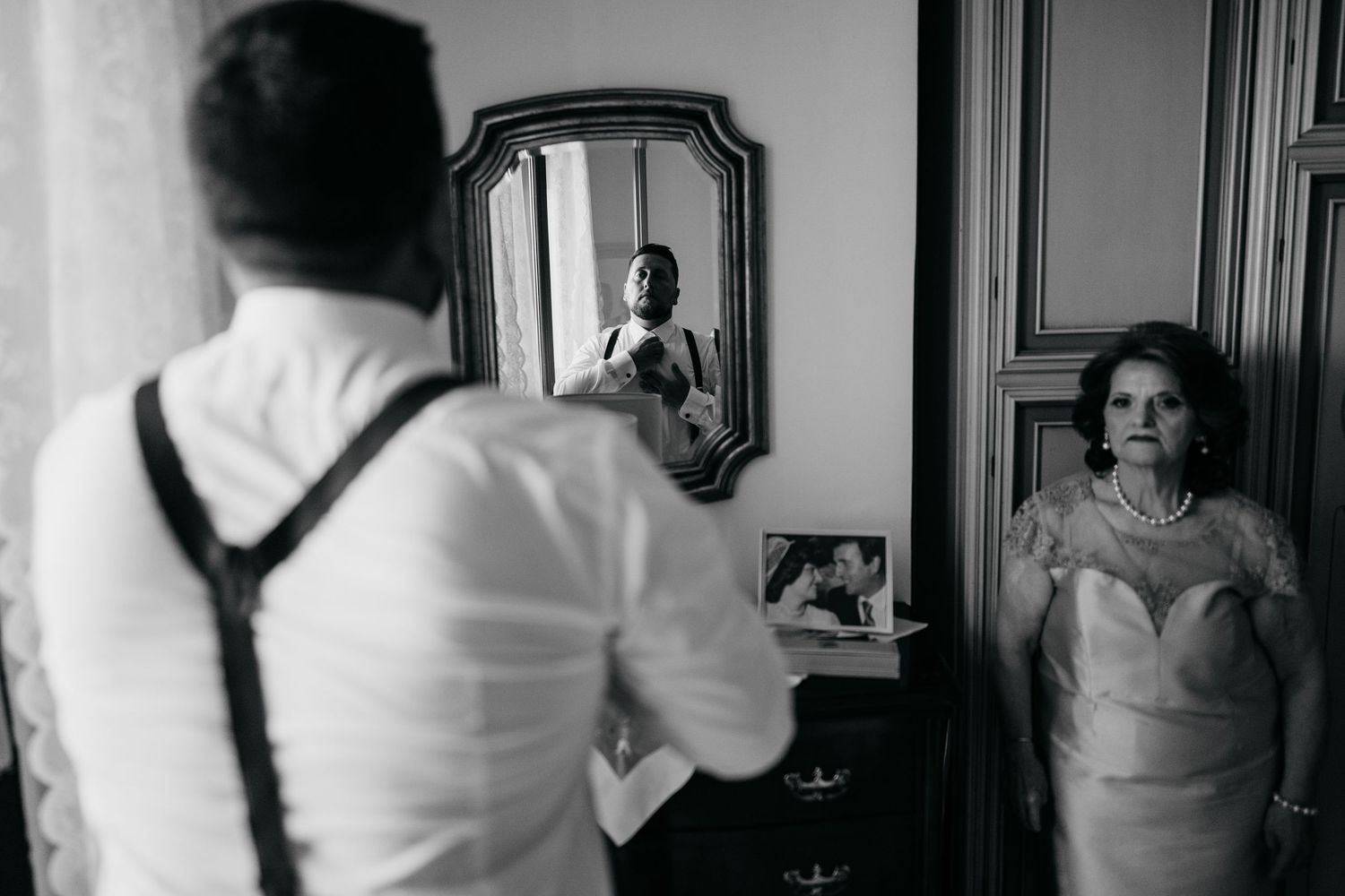 A black and white photo collage showing six different moments of a bride getting ready for her wedding day.