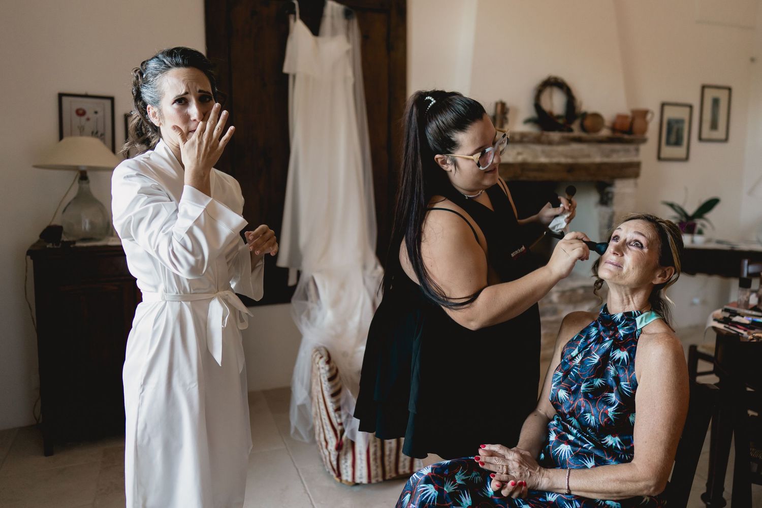 A wedding preparation scene with makeup artists and stylists getting ready for the big day.