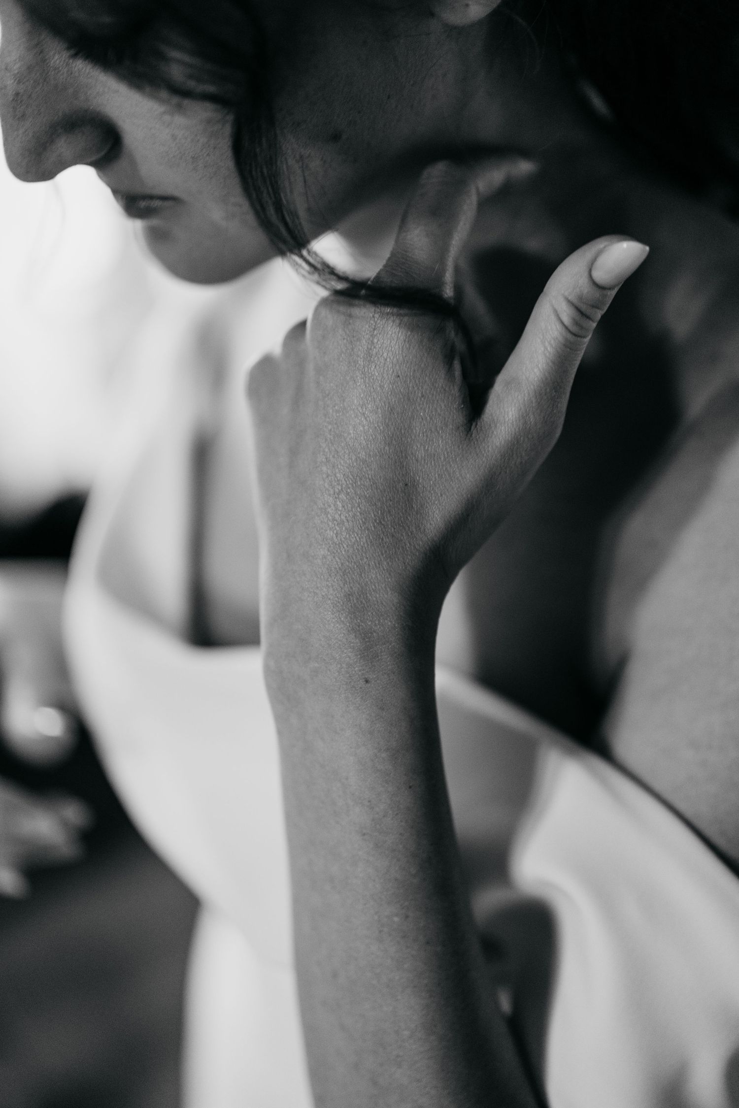 Artistic black and white close-up shots capture intimate wedding day moments.