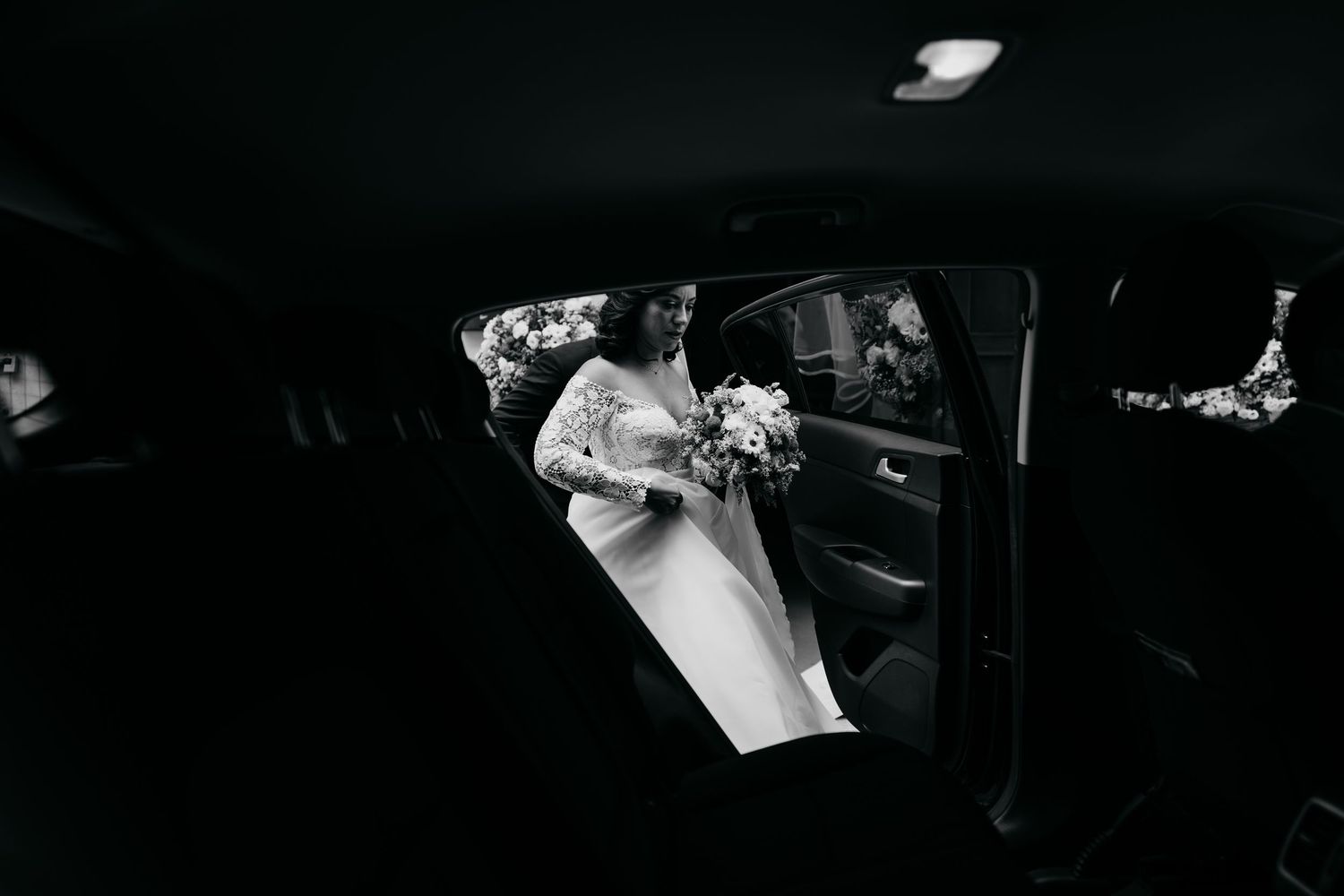 Dark silhouettes of people against a black background creating dramatic contrast.