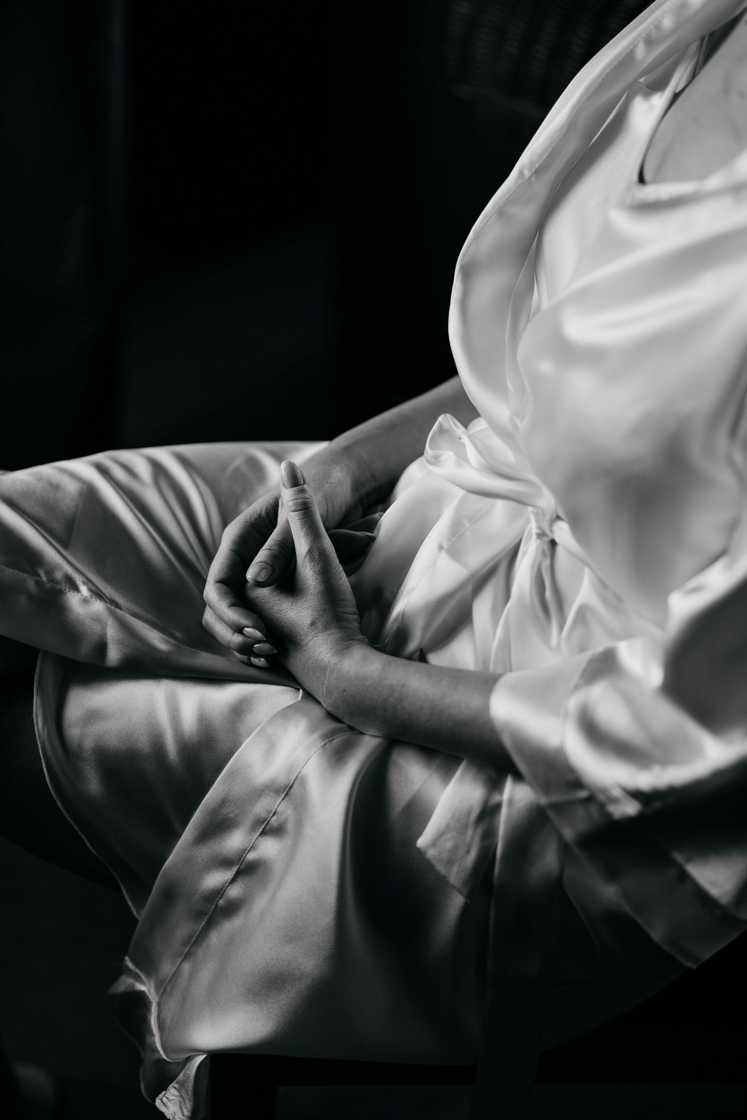 Close-up black and white sequence showing the elegant flow and movement of white fabric against a dark background.