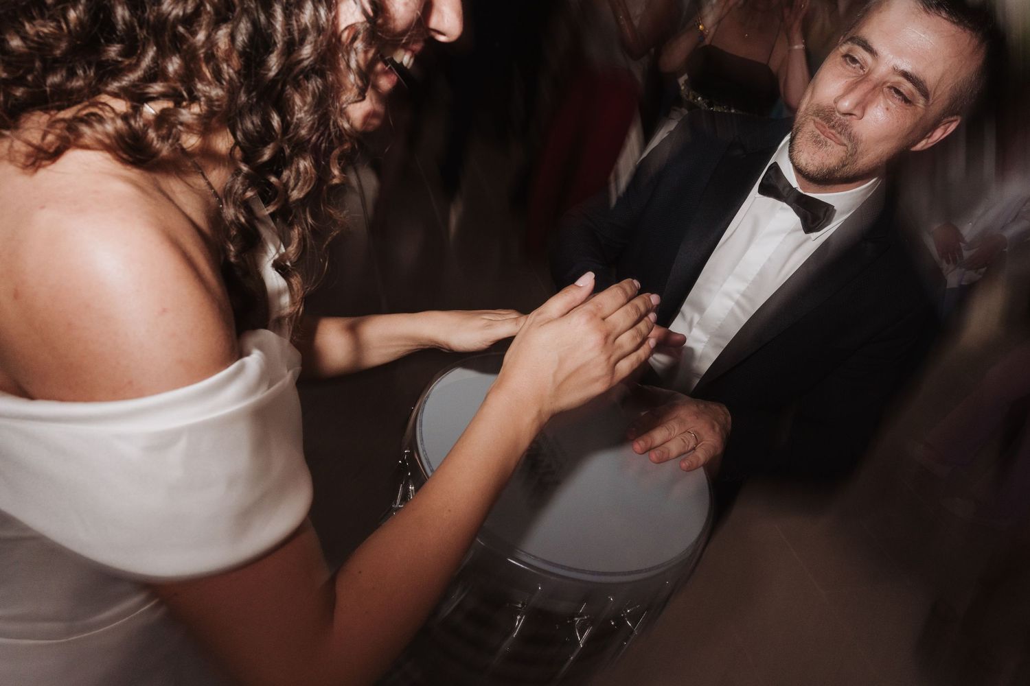 Intimate moment captured during wedding reception dance.