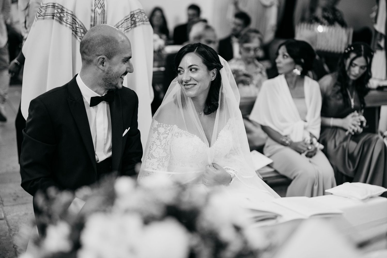 Candid wedding reception moments captured in black and white photography.