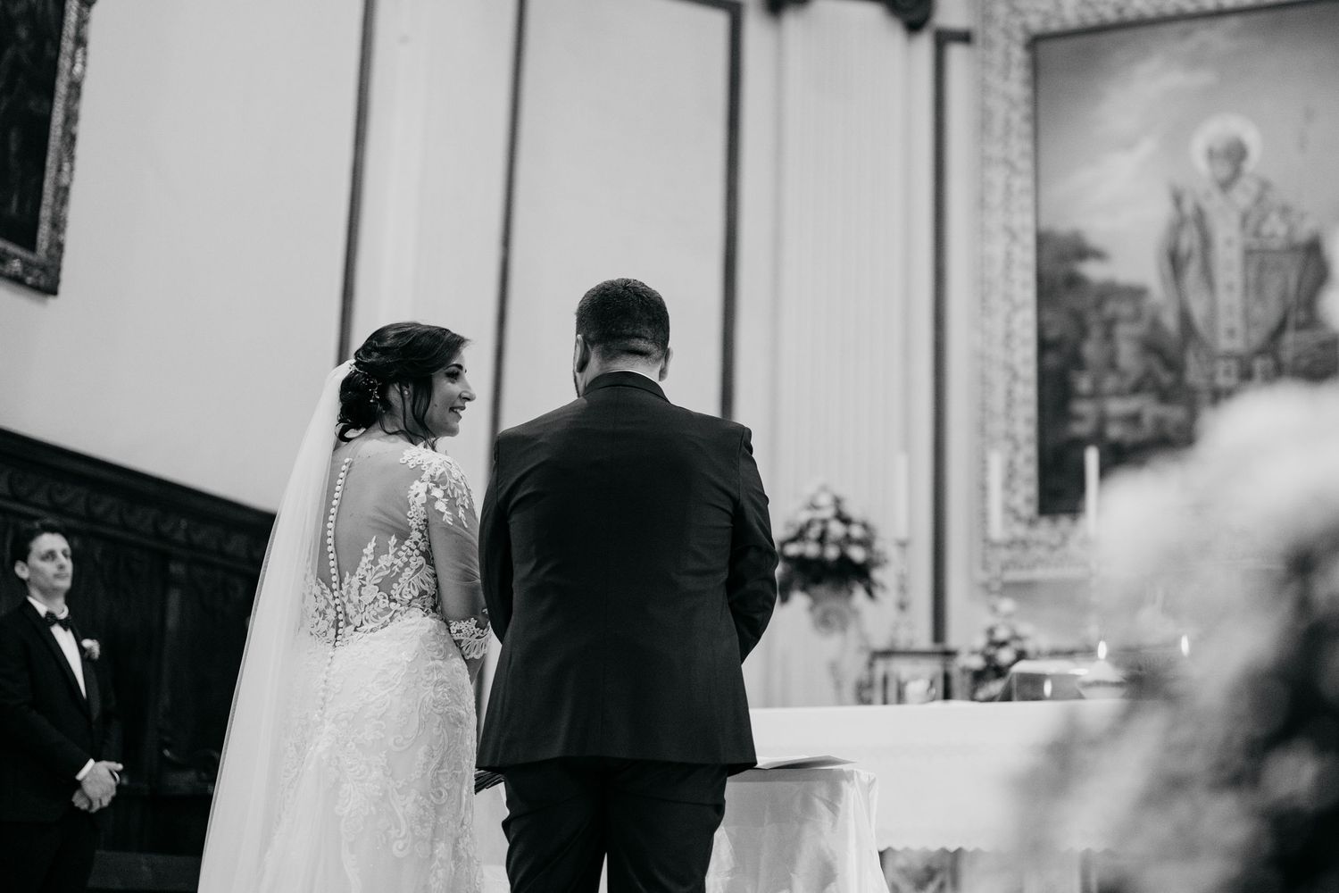 Wedding ceremony proceedings captured in classic black and white photography.