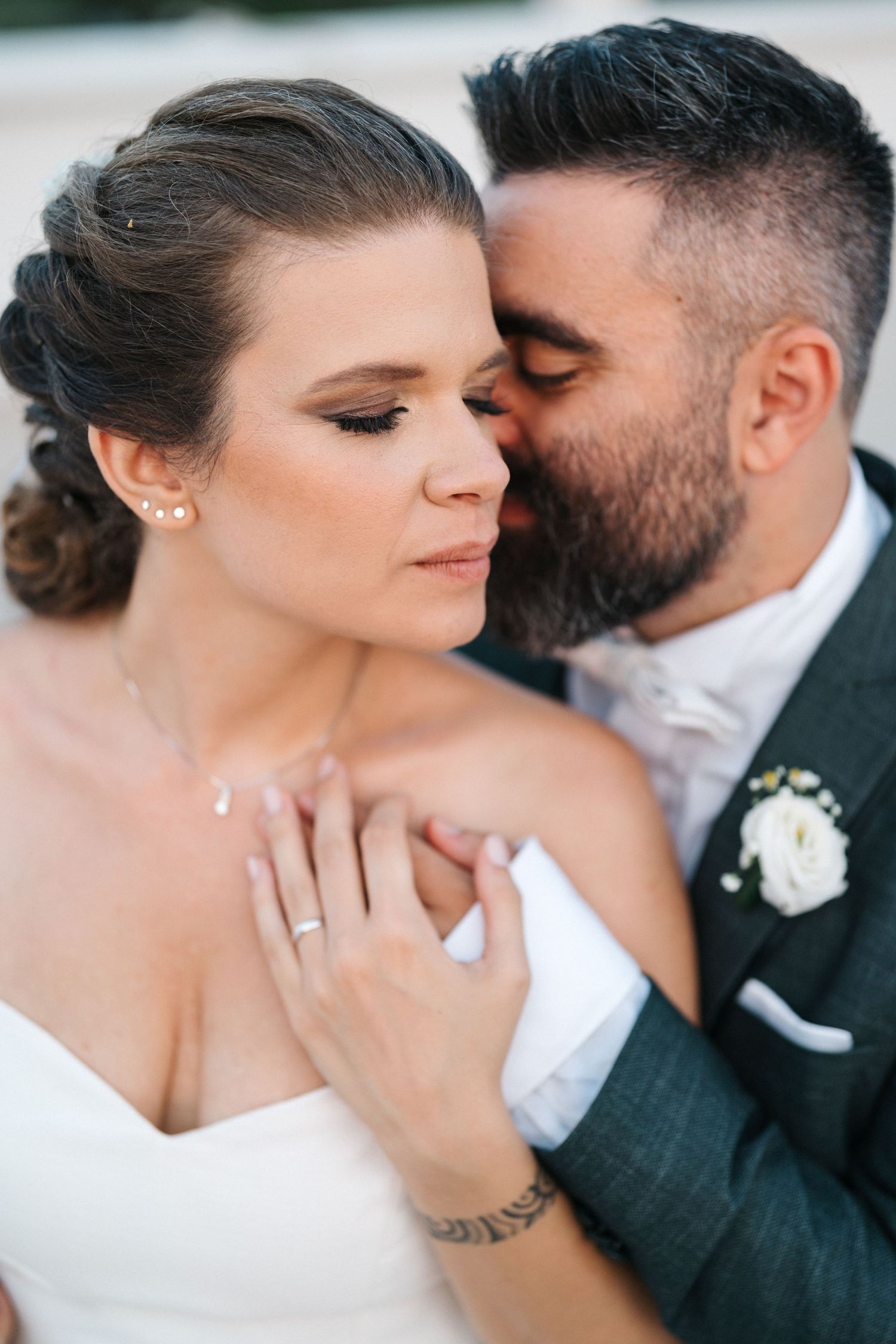 Romantic close-up portrait of newlyweds sharing an intimate moment.