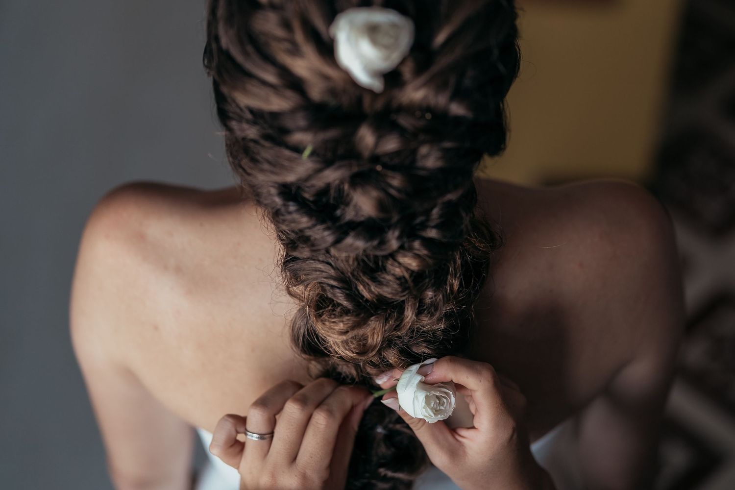 Close-up of an intricate braided hairstyle with decorative details.