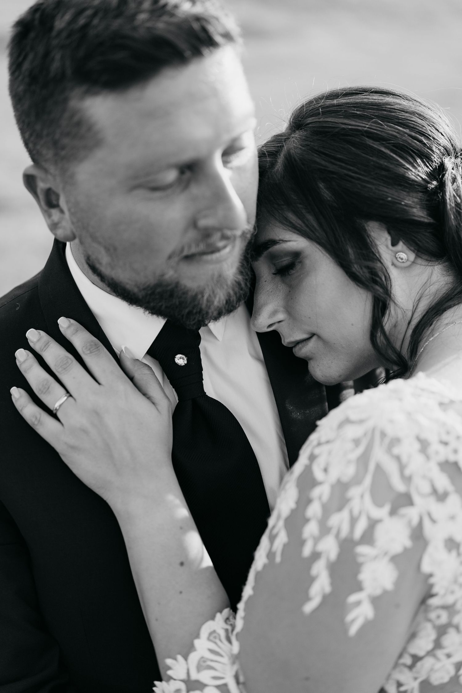Series of romantic black and white close-up shots capturing intimate moments between bride and groom.