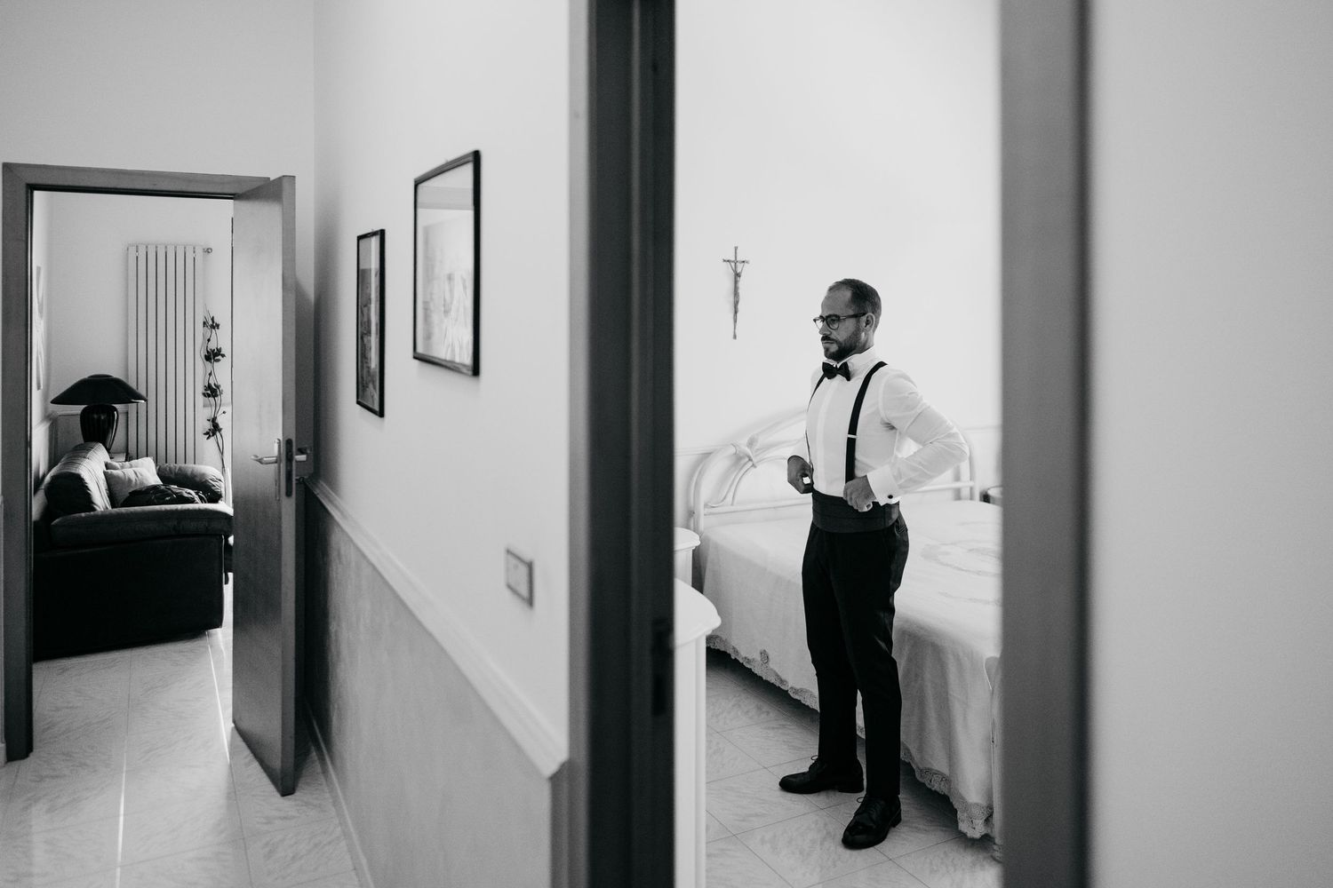 Minimalist black and white hallway scenes capturing wedding day preparations.