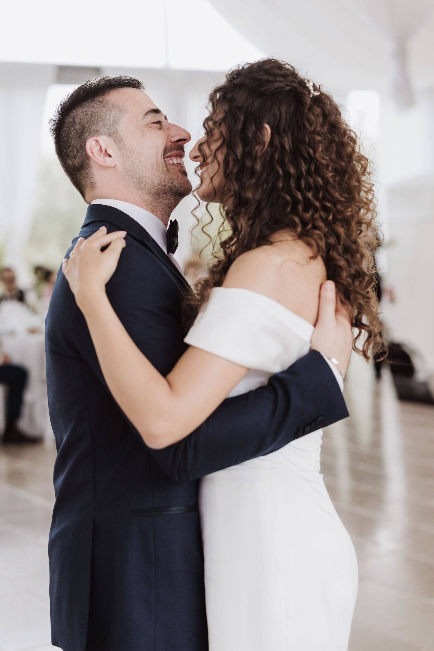 Close-up shot of a couple sharing an intimate moment during their wedding dance.
