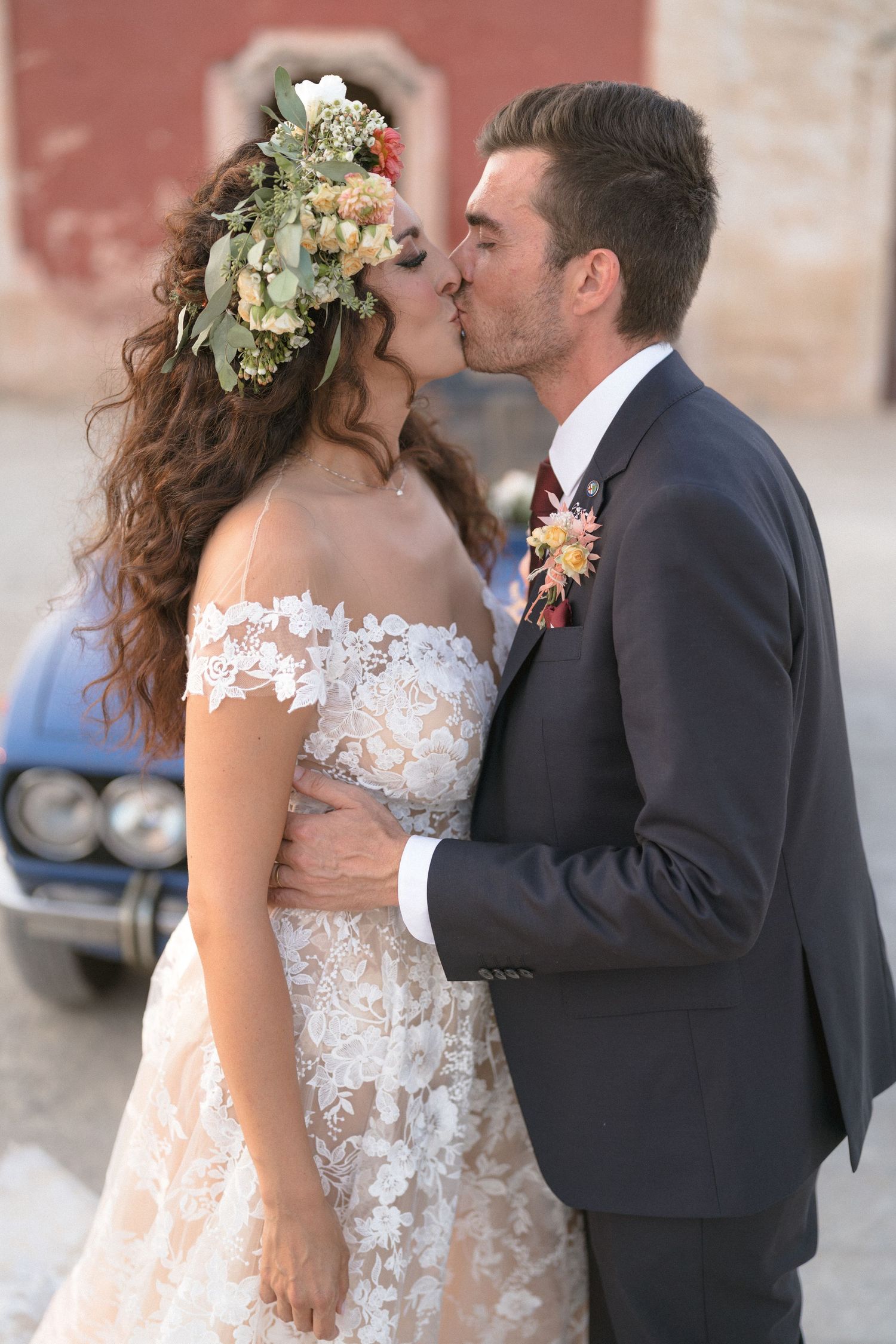 Romantic wedding couple sharing intimate moments in elegant attire.