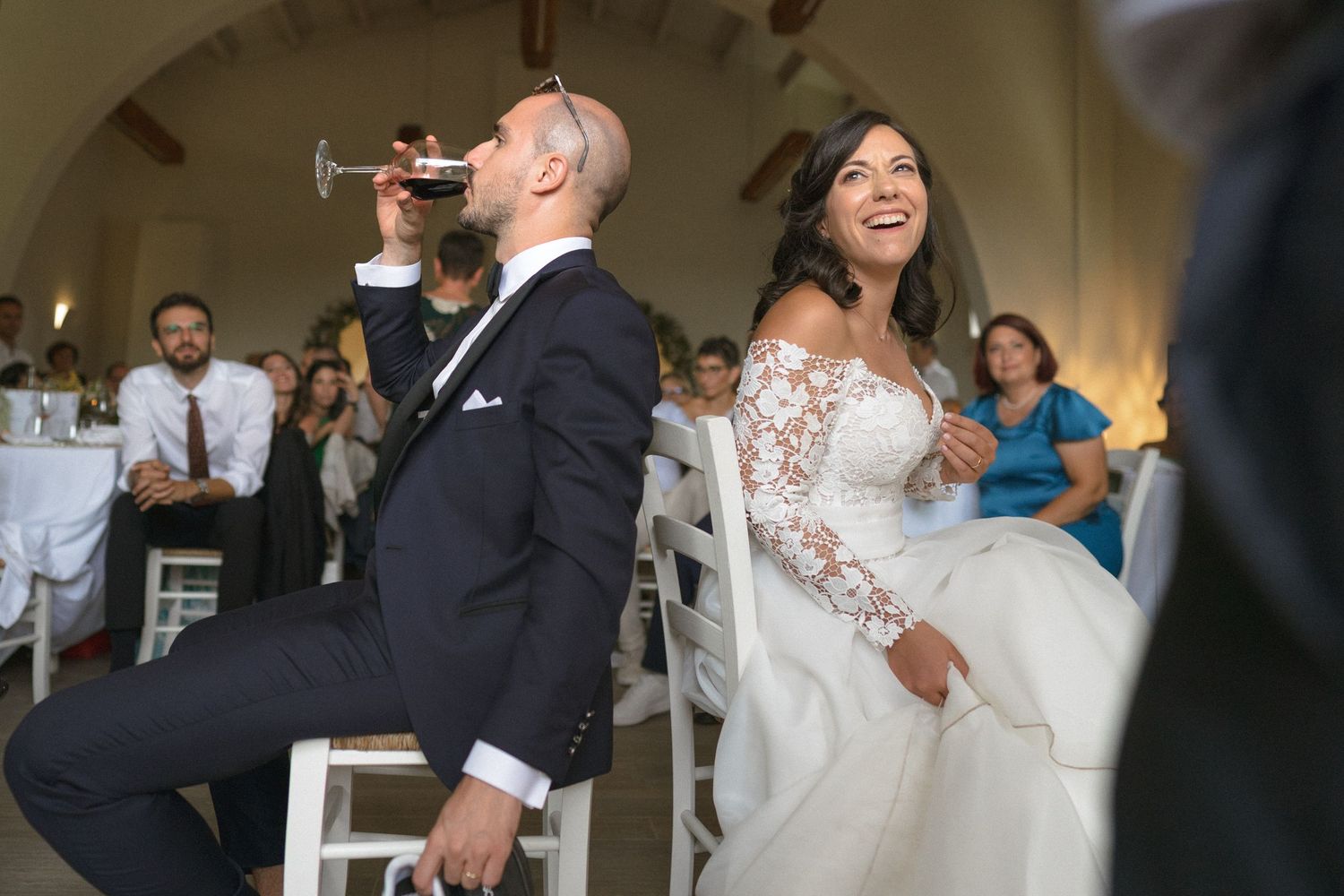 Wedding reception celebration with dancing and festivities in an indoor venue.