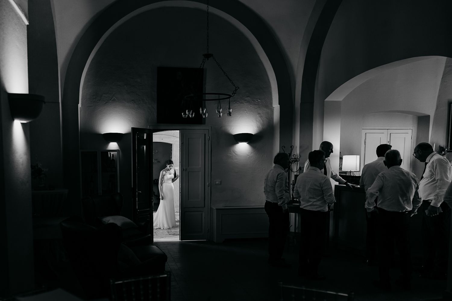 A dark, moody sequence of black and white film noir style architectural interior shots with dramatic lighting.