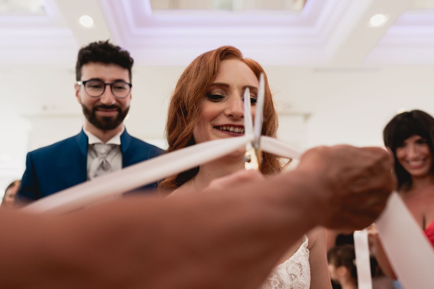 A celebratory moment captured during a wedding reception with confetti and laughter.