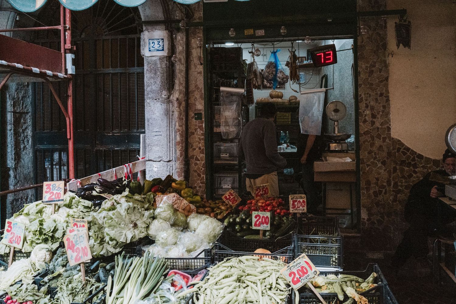 Fresh vegetables and produce displayed at a local market stall.