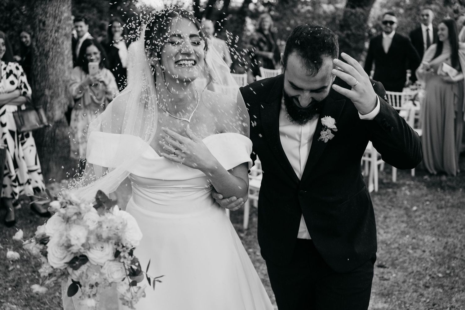 Black and white candid wedding celebration photos showing joyful moments outdoors.