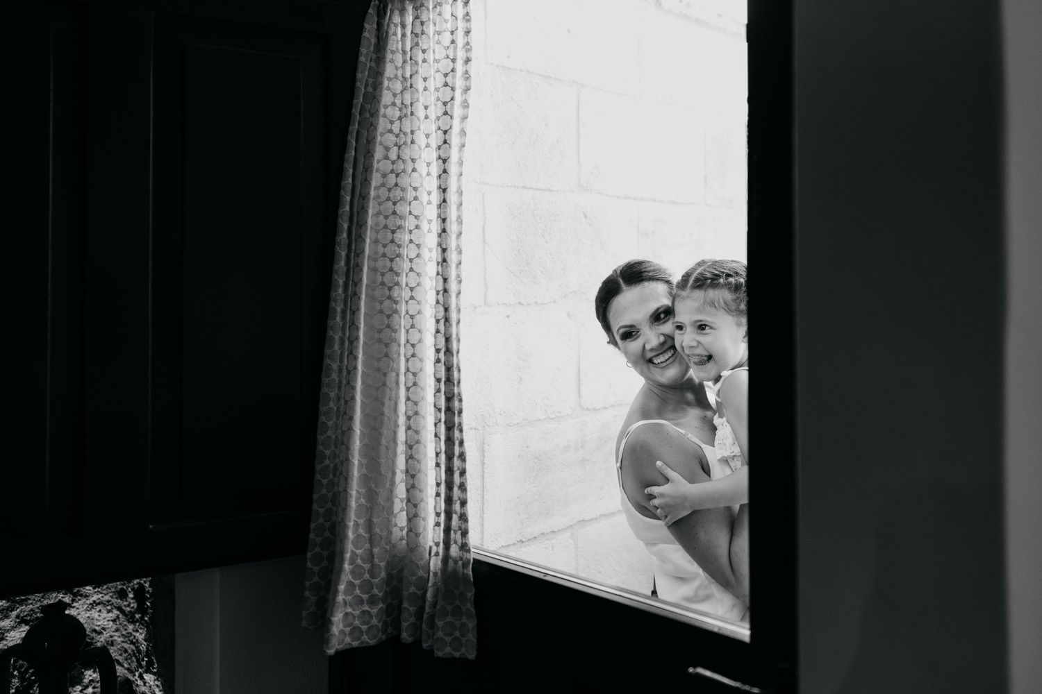 Black and white window portraits showing dramatic lighting and curtains.
