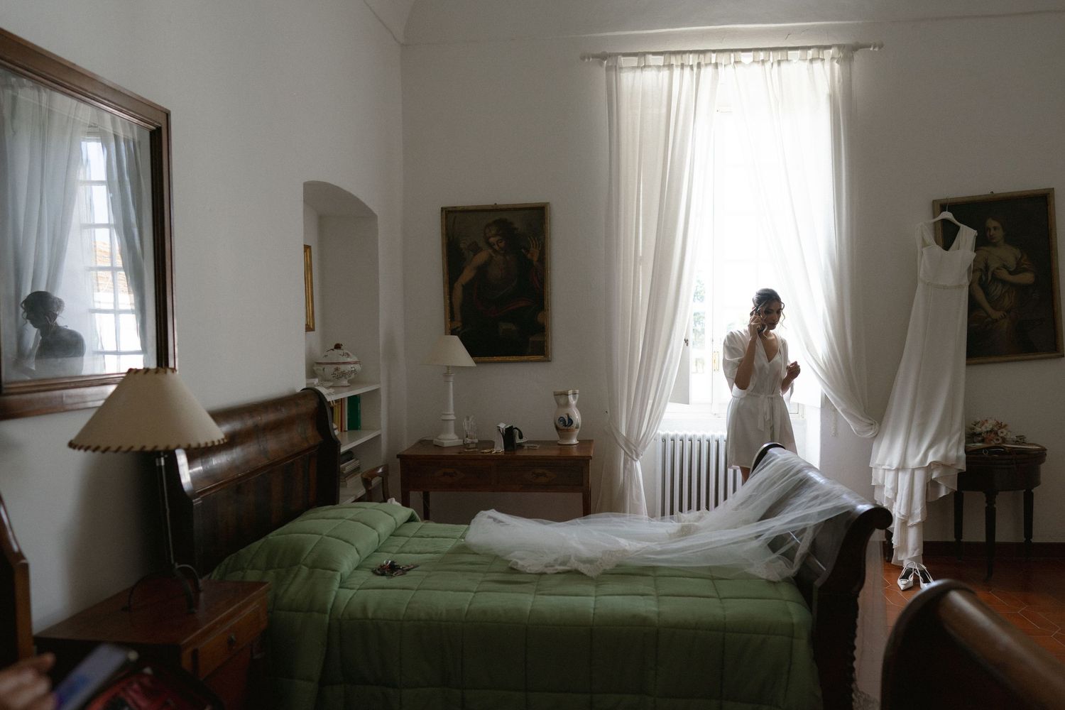 Interior shots of an elegant white room with classic furniture and natural lighting.