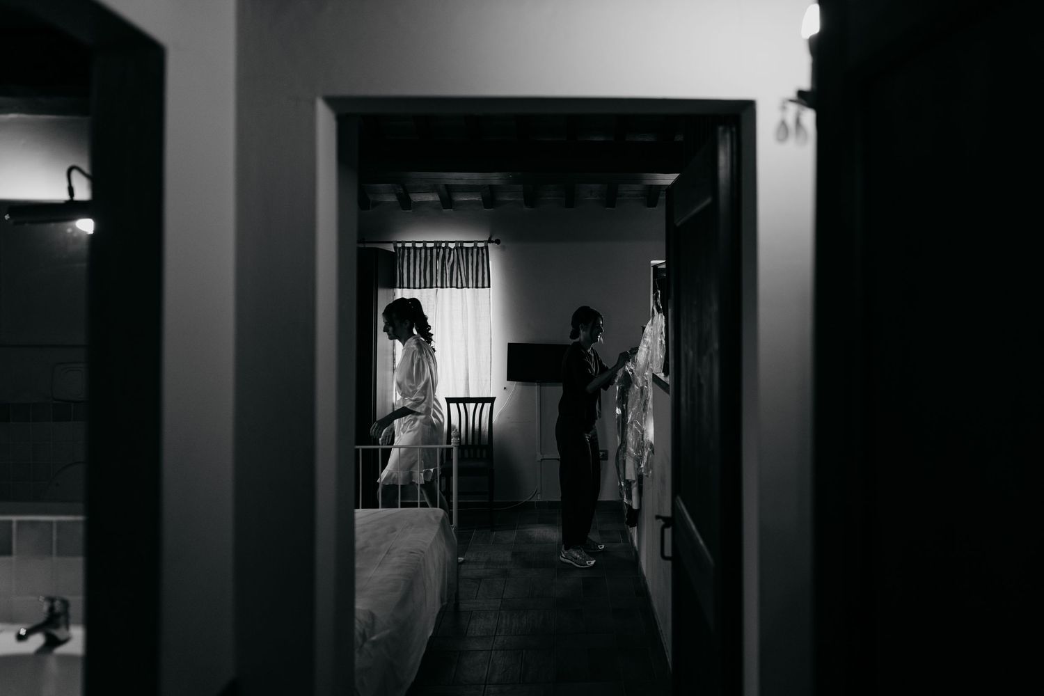 Dramatic black and white hallway shots creating moody architectural perspectives.