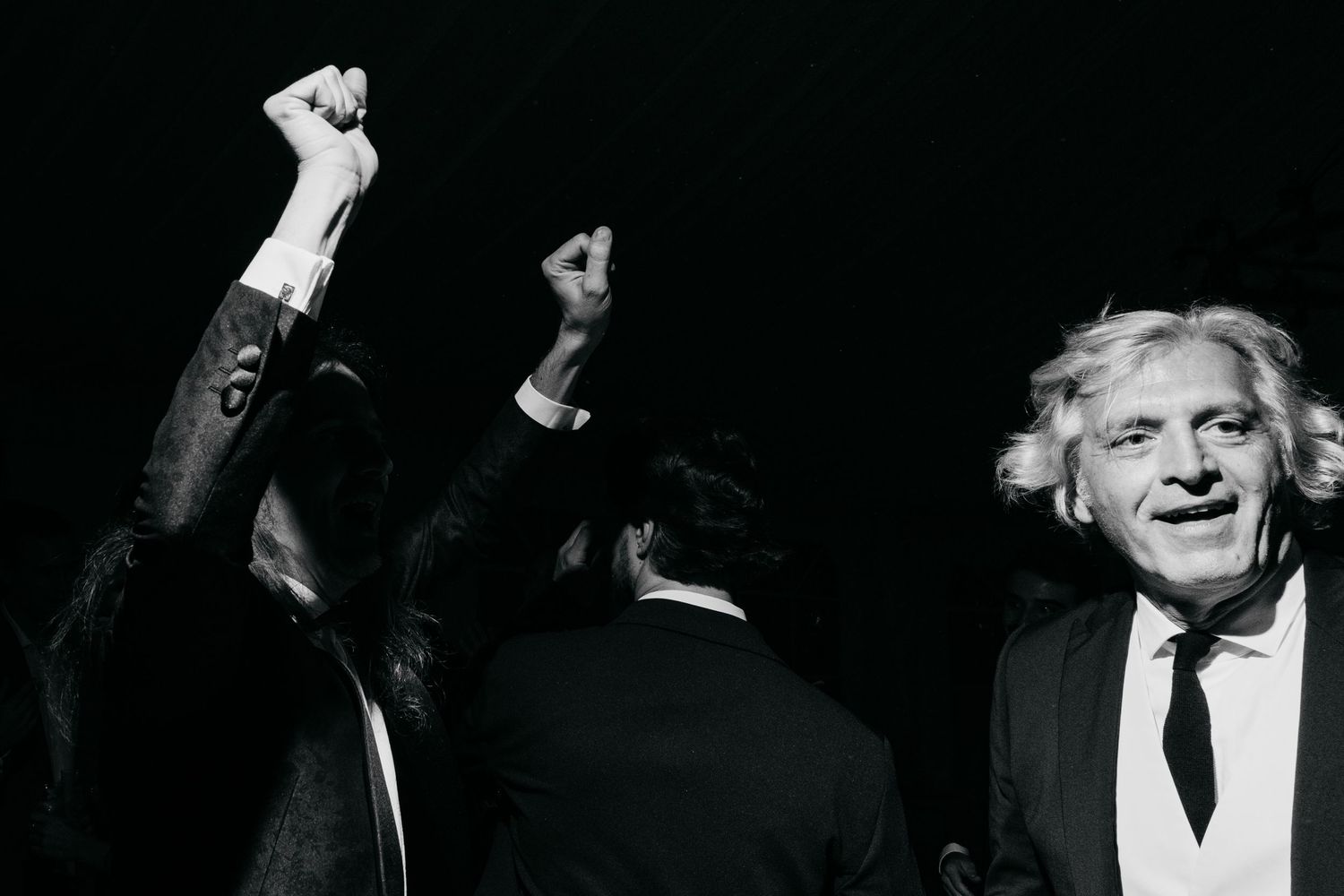 Black and white candid shots of celebratory moments at a festive gathering.