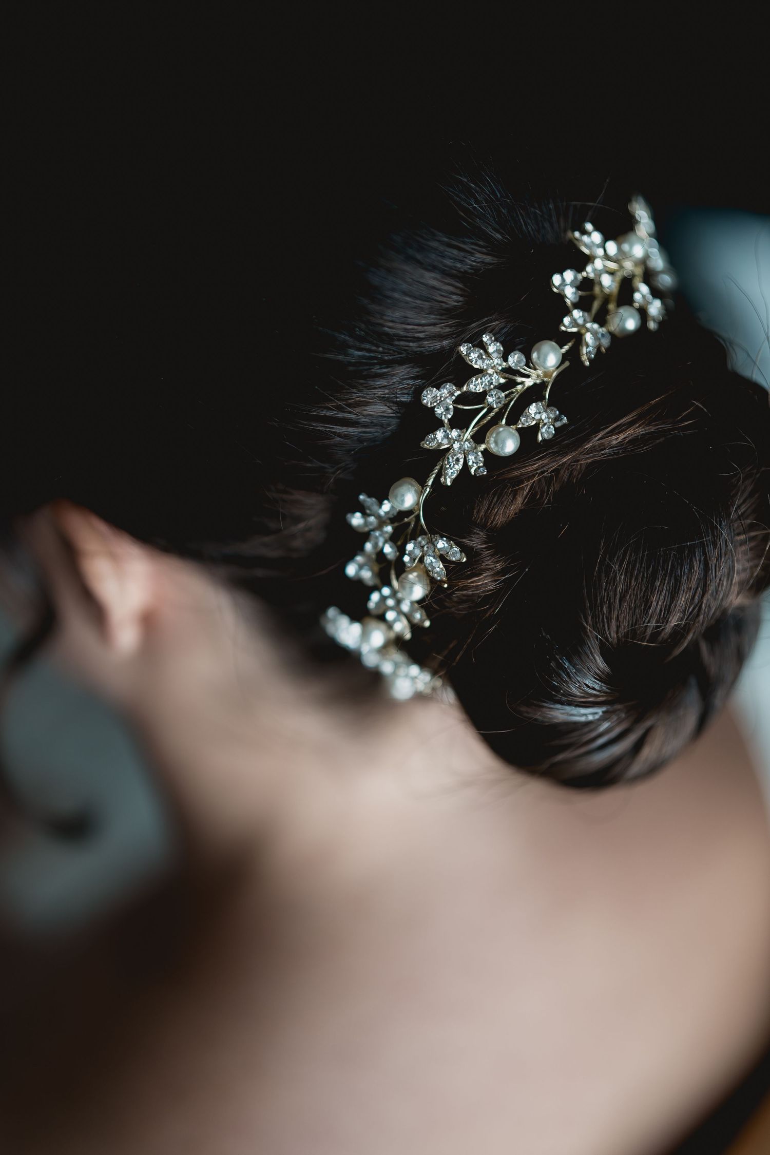Delicate crystal hair accessory adorning a bridal hairstyle.