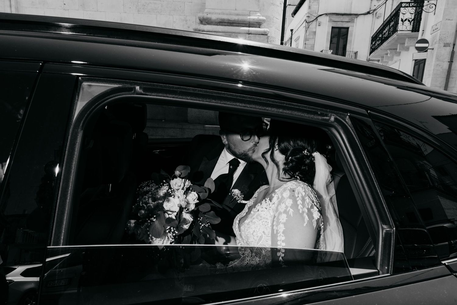 Wedding party arriving in luxury cars for the celebration.