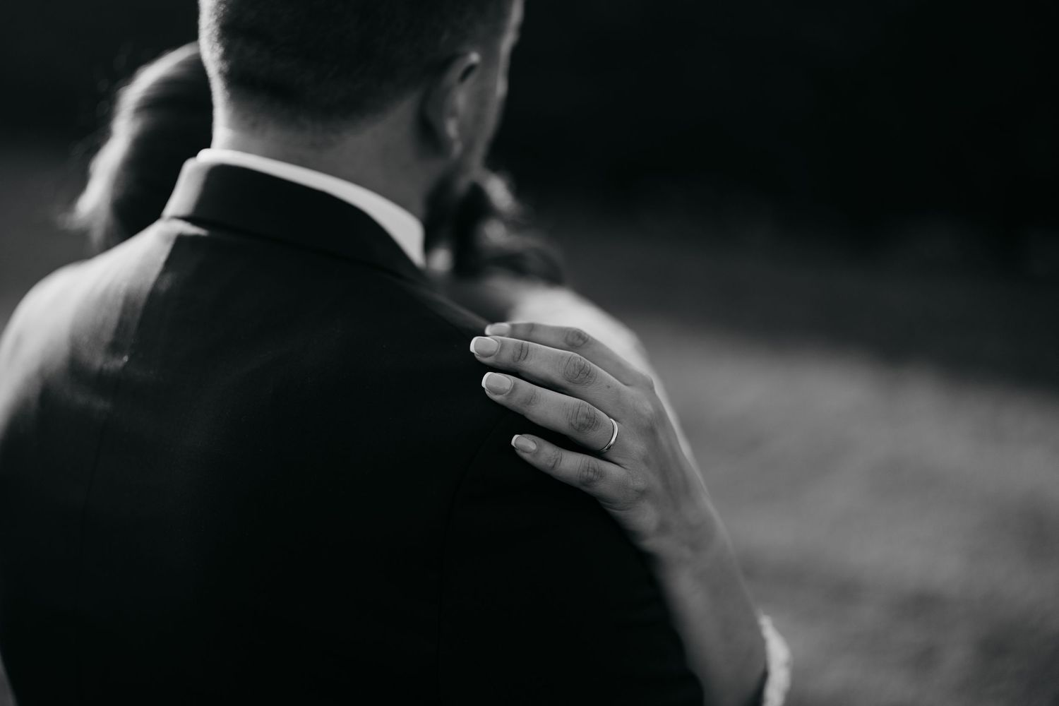 Dramatic black and white close-up shot of wedding couple.