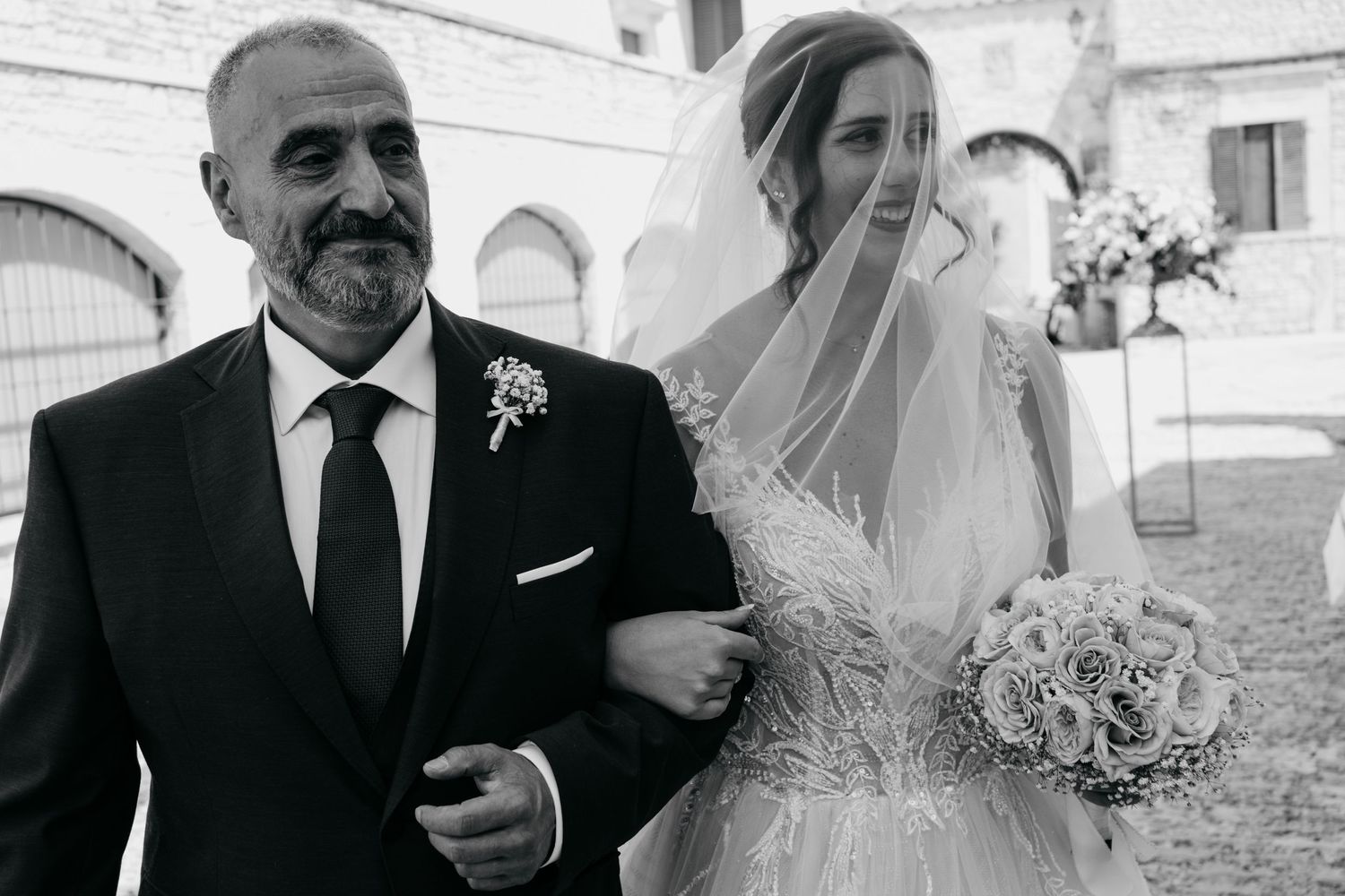 An emotional wedding moment captured in black and white photography.