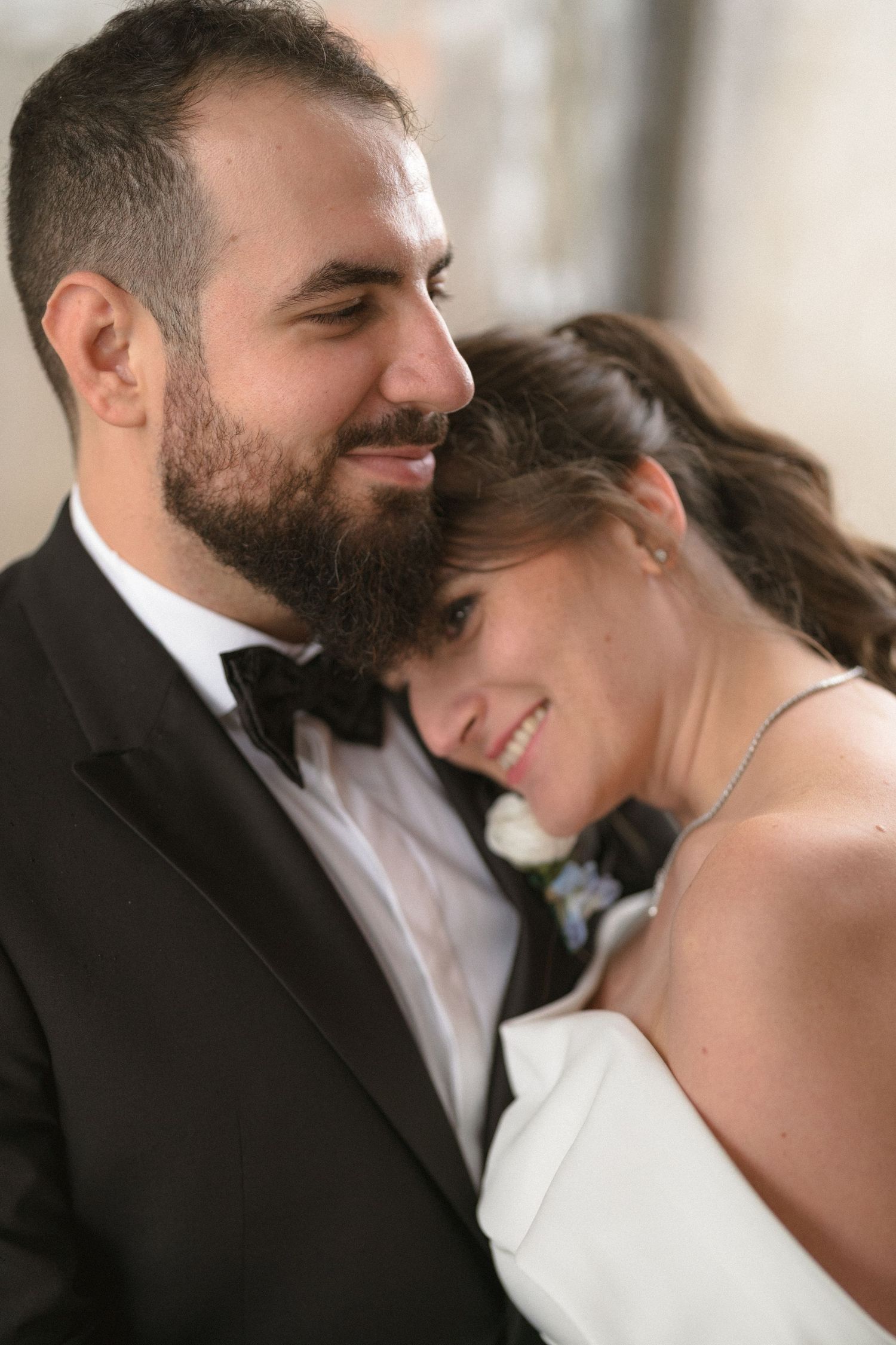 Intimate close-up moments between newlyweds in formal wedding attire.