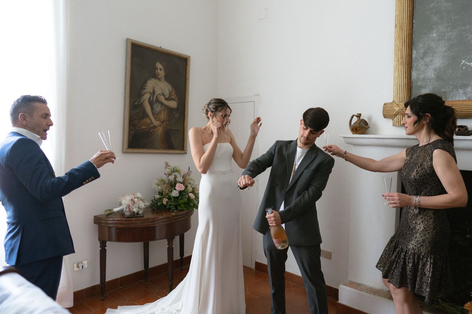 Wedding preparations in a bright room with people getting ready for the ceremony.