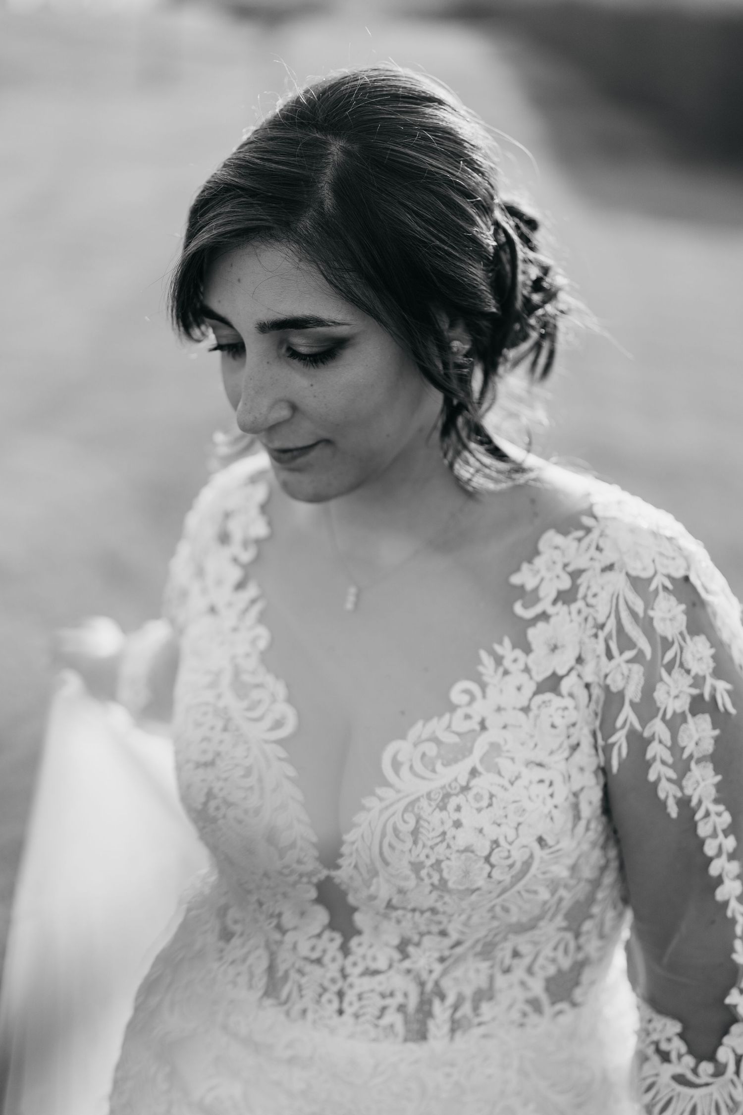 Close-up series of a delicate lace wedding dress neckline with intricate embroidery details.