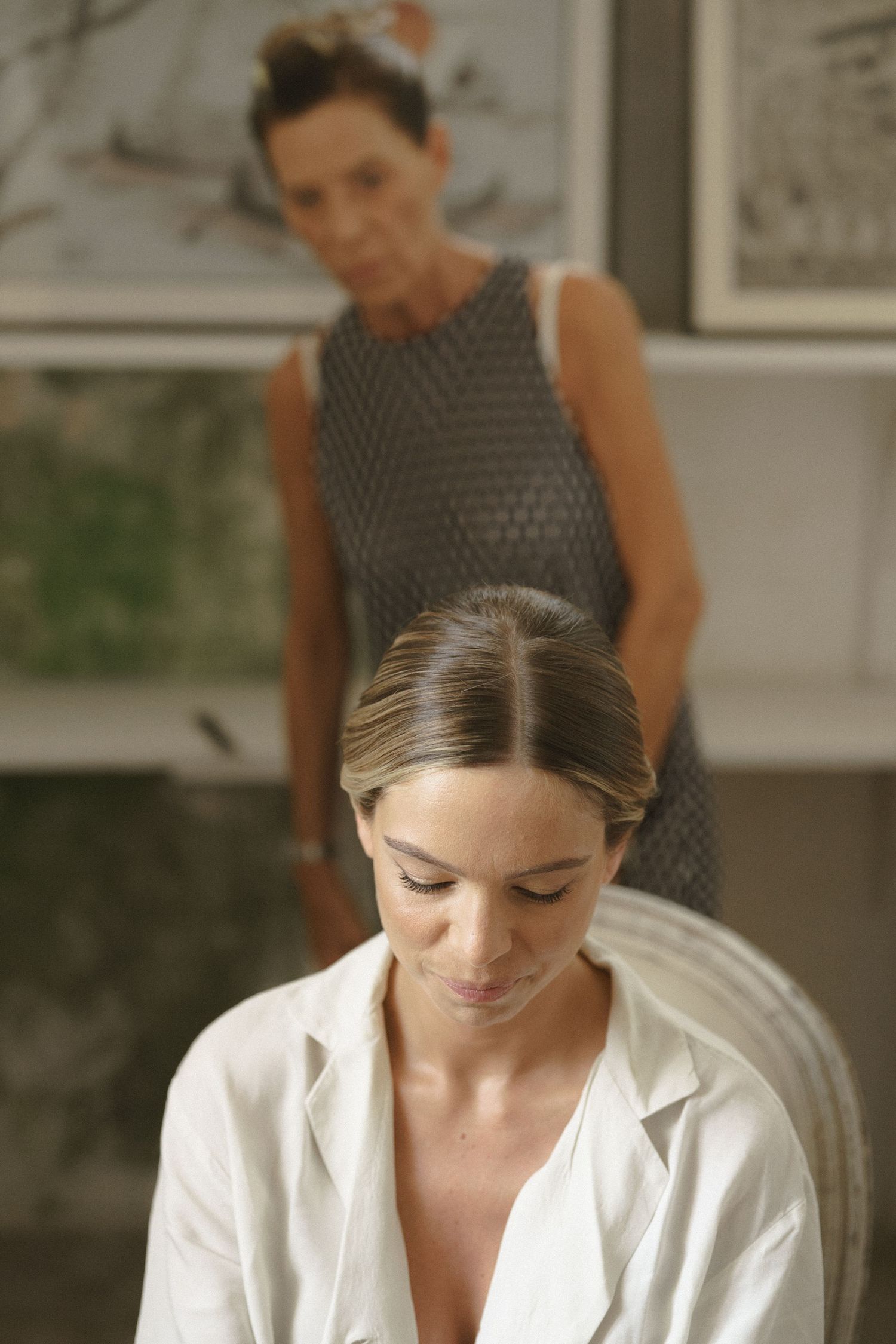 A quiet moment of wedding preparation in an intimate indoor setting.