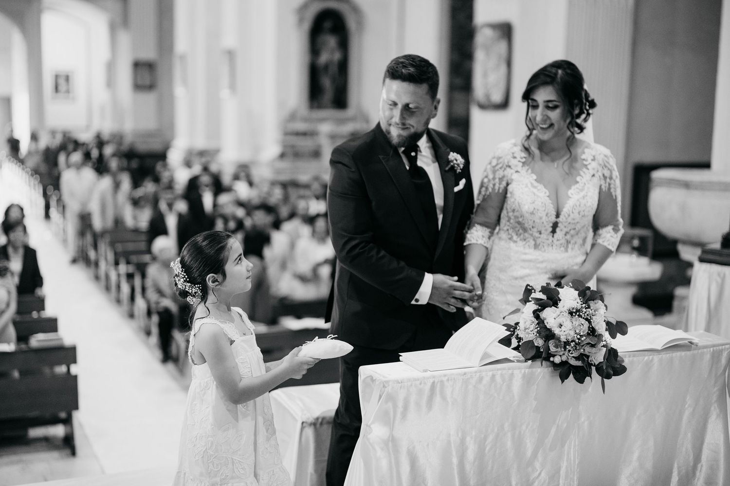 Elegant wedding reception scene with decorative details in black and white.