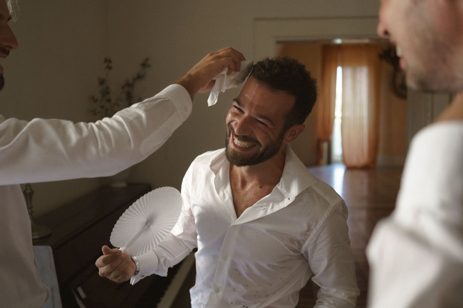 A joyful getting-ready moment shared between friends during preparation for a special event.