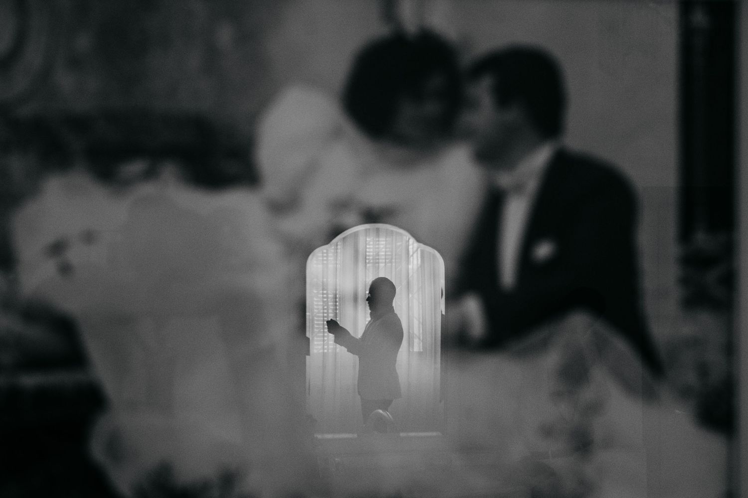 Black and white photo series showing wedding day preparations and moments.