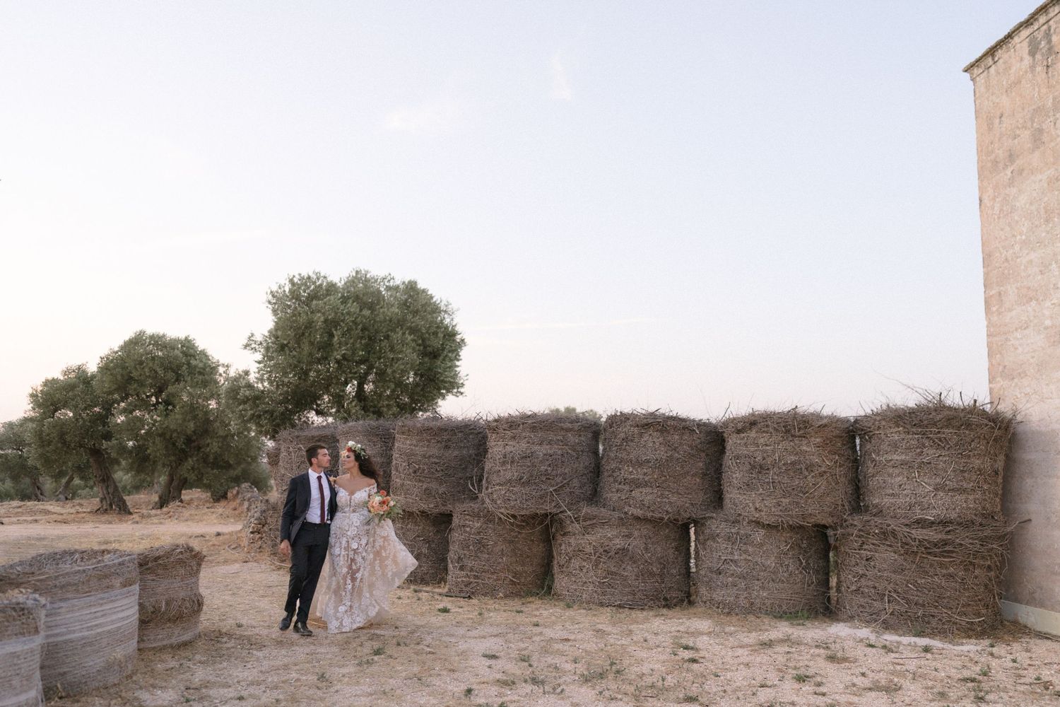 Rustic stone wall and courtyard setting at a wedding venue.