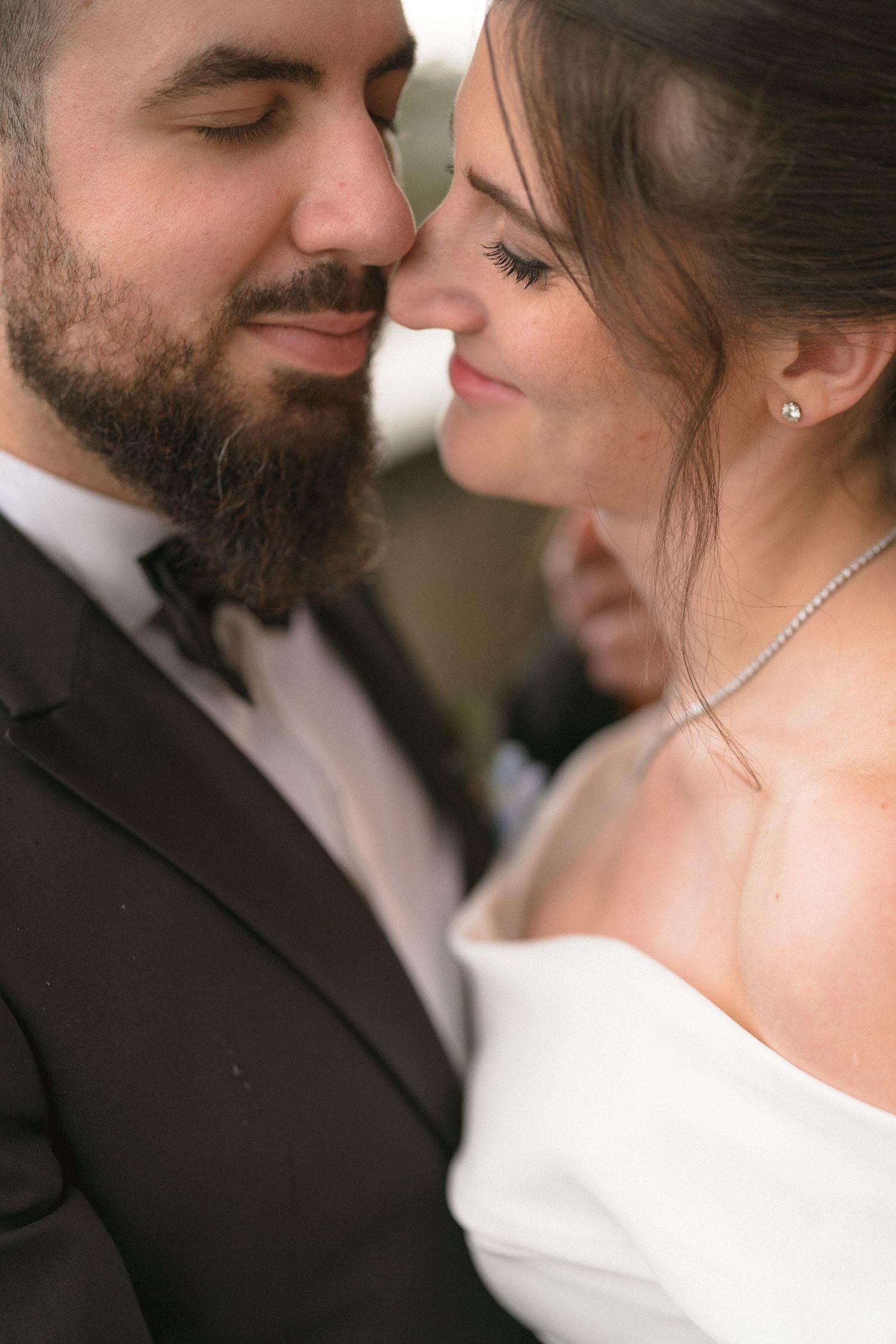 Intimate close-up of newlyweds sharing a romantic moment.