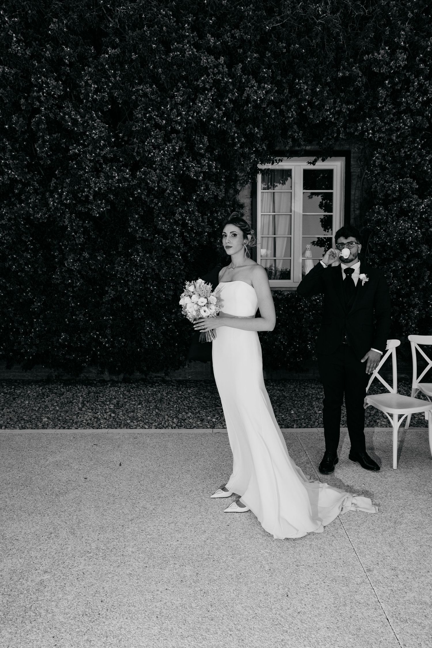 Black and white romantic dance sequence against a garden backdrop.