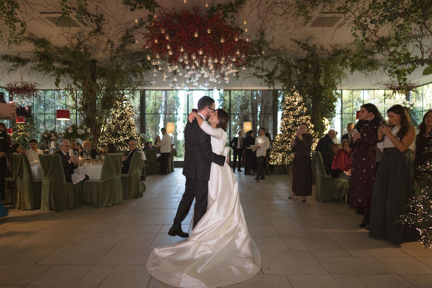 Bride and groom share first dance in a beautifully decorated wedding venue.