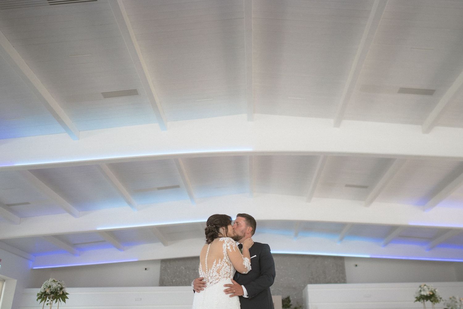 Romantic wedding reception sequence showing couples dancing and celebrating in an elegant indoor venue.