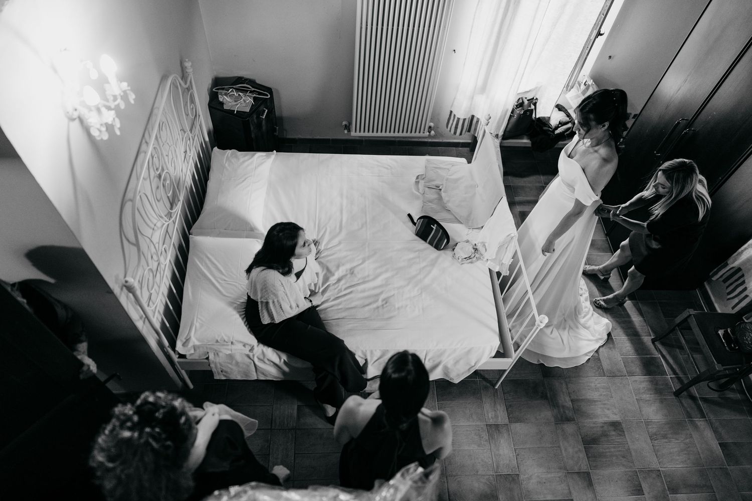 Overhead view of wedding preparations in a bright room with white decor.