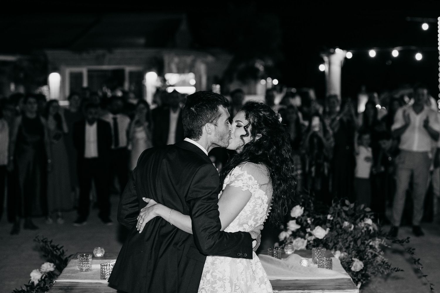 Wedding reception dance floor with guests celebrating in black and white.