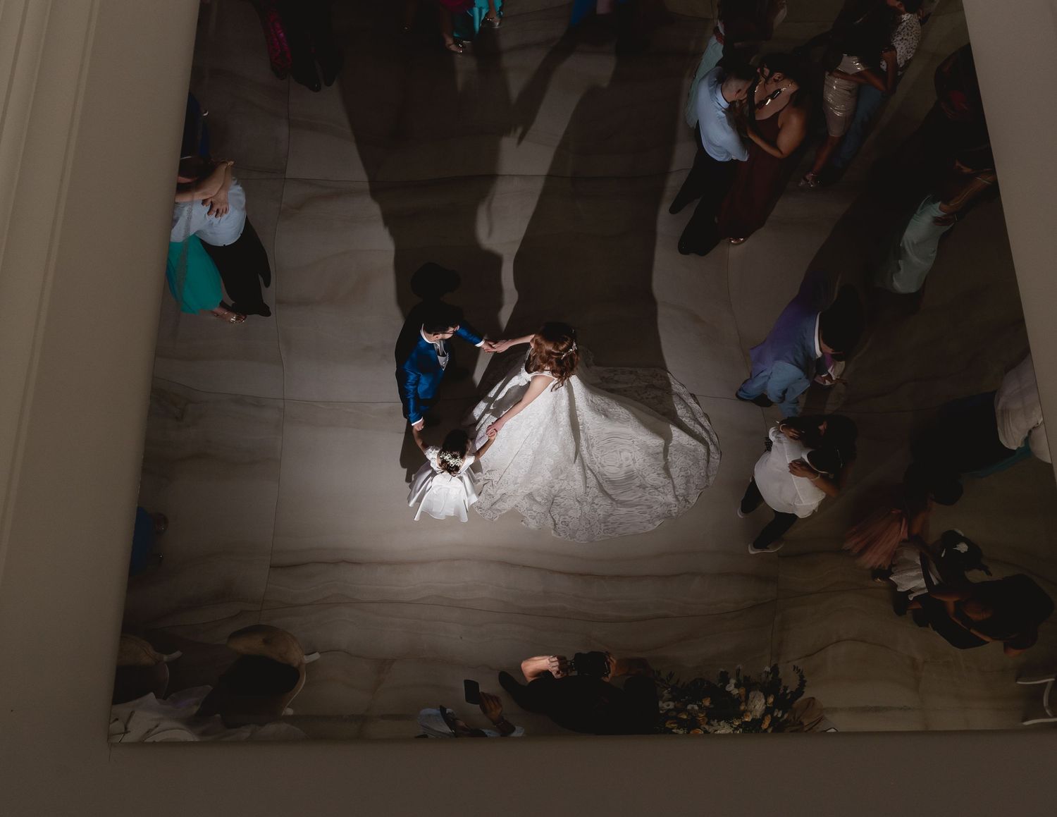 Overhead view of a ballroom dance floor during a wedding celebration.