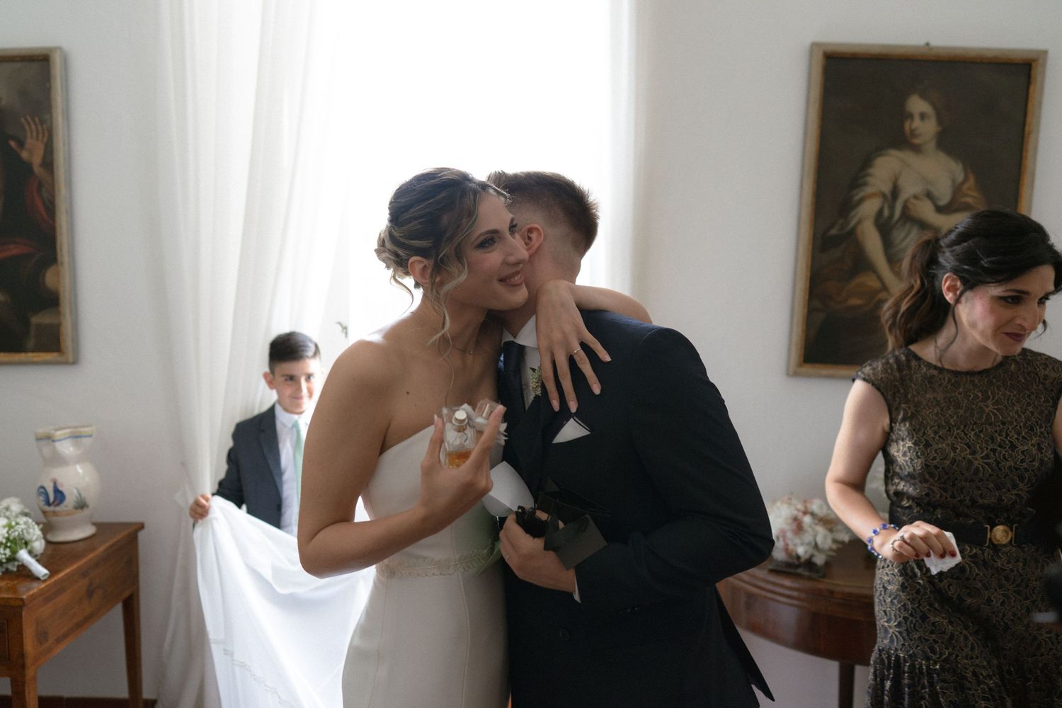 A series of candid wedding photos showing intimate moments between couples dancing and embracing at a reception.